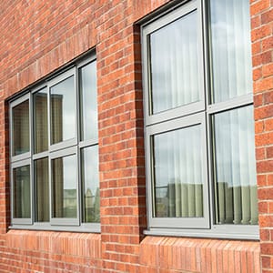 Exterior of a brick building and close up to a window